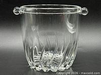 Front view of clear glass ice bucket showing vertical cuts and handles