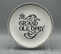 Front view of decorative plate displaying logo and rim design