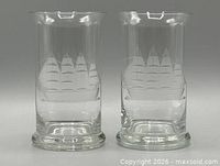 Two clear etched ship highball glasses front view