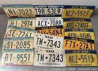 All fifteen replica licence plates arranged together