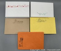 Front view showing five envelope colour/design variations