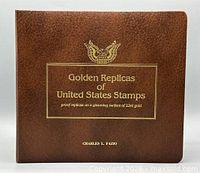 front cover of brown leatherette binder with gold text