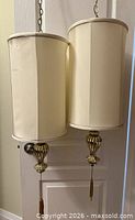 Two swag pendant lamps hanging showing overall design