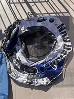 Deflated Intex River Run inflatable tube showing mesh seat, cup holders and branding
