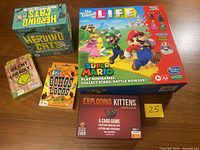 Front of all five game boxes displayed on table