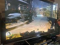 Front view of Panasonic plasma TV displaying image while powered on