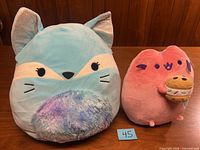 Both plush toys side by side for scale and overview
