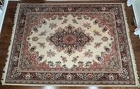 Full view of entire rug showing pattern, colors, fringe and overall wear