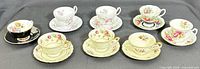 Group shot of all eight teacup and saucer sets