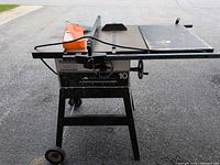 Front view of Beaver table saw on stand, rip fence in place