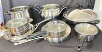 Entire 8-piece stainless cookware set displayed