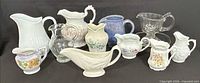 Group shot showing all pitchers, creamers and gravy boats