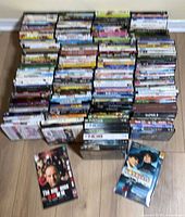 Stacked DVDs showing quantity and variety
