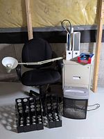 Group shot of entire lot showing chair, filing cabinet with lamp, shredder, magazine holders, file holders, webcam box, extension cords