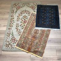 All three rugs displayed overlapping to show patterns and sizes