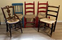 Front view of all five chairs showing color and style differences