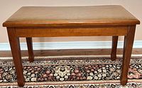 Full view of piano bench closed