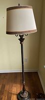 Full view of floor lamp showing height, shade, and finish