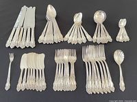 Full flatware set laid out showing all pieces