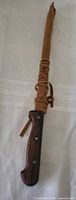 Knife in sheath, handle visible