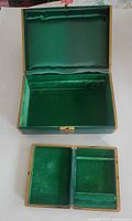 Open large jewelry box showing lined interior and insert tray