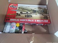 Boxed Airfix kit and assorted paints inside shipping carton