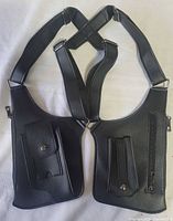 Front view showing both storage panels, straps and hardware