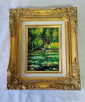 Front view showing painting and decorative frame