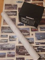 Safe and rolled poster on top of unrolled poster background