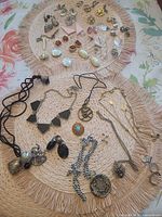 Overview of all jewelry pieces on two woven mats