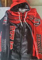 Front view showing graphics, hood, zipper, drawstring