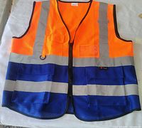 Front view of orange and navy safety vest with reflective stripes