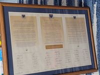 Full view of framed document showing text and signatures