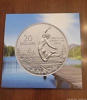 Front of illustrated folder featuring enlarged coin design