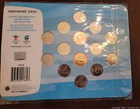 Back of card with Olympic branding, coin positions and barcode