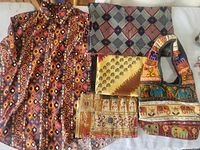Front view of tribal print shirt, three fabric pieces and handbag