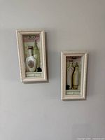 Both framed wall decor pieces side by side