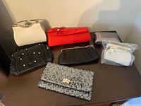 Group shot showing all seven clutches on tabletop