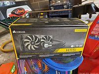 Front angled view of Corsair H115i retail box