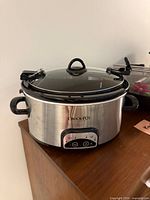 Front view of Crock-Pot slow cooker showing stainless exterior, control panel and lid