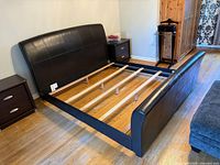 Full view of bed frame, headboard, side rails, slats, surrounding furniture excluded
