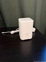 Front view of Eufy HomeBase 2 showing brand logo, status LED, attached power cable