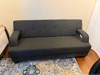 Front view of grey upholstered sofa