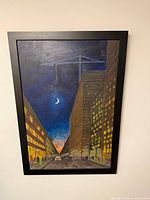 Front view of framed night city scene painting