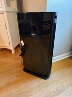 Front view of Shark HE601C air purifier showing display and grille
