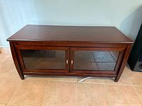 Full view of wood TV stand front and top