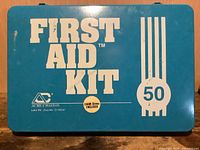 Exterior of blue metal First Aid Kit 50 case front view