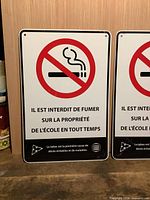 Front view of both signs showing graphics and wording