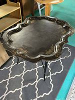 Top view showing scalloped shape and painted floral design