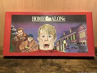 Front of red Home Alone game box with movie artwork